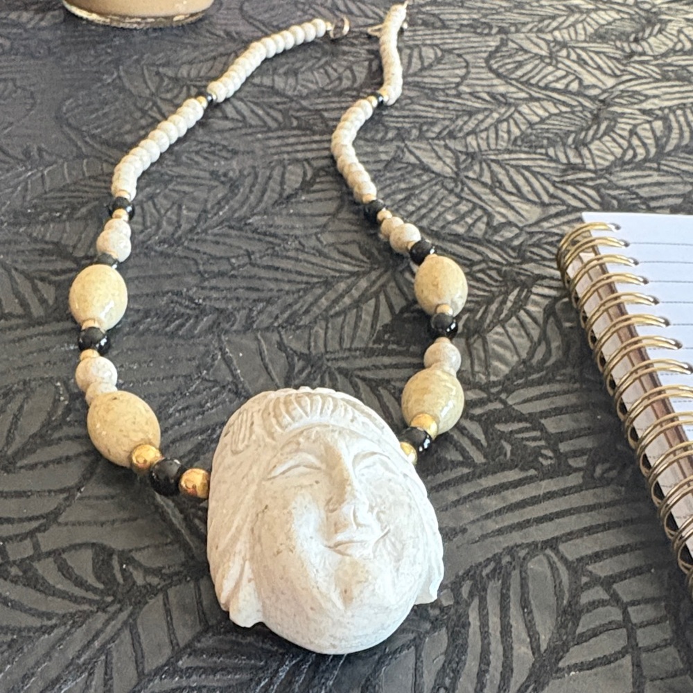Elegant Beige and Black Beaded Necklace carved face of poss budda (estate sale)